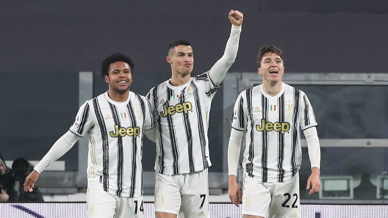 TURIN, ITALY - FEBRUARY 06: Cristiano Ronaldo of Juventus celebrates with team mates Weston McKennie and Federico Chiesa after scoring to give the side a 1-0 lead during the Serie A match between Juventus and AS Roma at Allianz Stadium on February 06, 2021 in Turin, Italy. Sporting stadiums around Italy remain under strict restrictions due to the Coronavirus Pandemic as Government social distancing laws prohibit fans inside venues resulting in games being played behind closed doors.