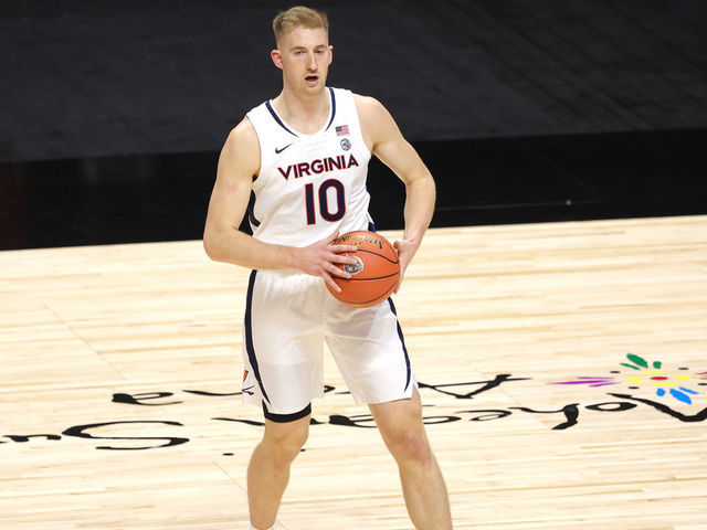UNCASVILLE, CONNECTICUT - NOVEMBER 25: Sam Hauser #10 of the Virginia Cavaliers looks to pass against the Towson Tigers during the first half at Mohegan Sun Arena on November 25, 2020 in Uncasville, Connecticut.