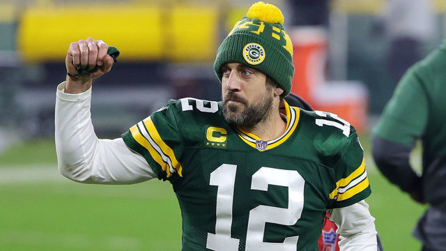 GREEN BAY, WISCONSIN - JANUARY 16: Aaron Rodgers #12 of the Green Bay Packers celebrates defeating the Los Angeles Rams 32-18 in the NFC Divisional Playoff game at Lambeau Field on January 16, 2021 in Green Bay, Wisconsin.