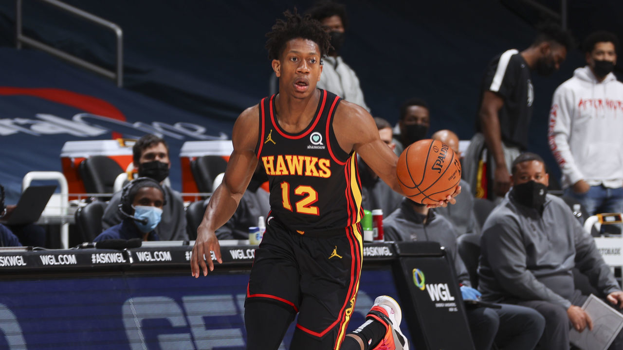 WASHINGTON, DC - JANUARY 29: De'Andre Hunter #12 of the Atlanta Hawks dribbles during the game against the Washington Wizards on January 29, 2021 at Capital One Arena in Washington, DC. Mandatory Copyright Notice: Copyright 2021 NBAE