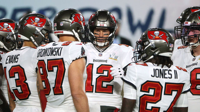 TAMPA, FLORIDA - FEBRUARY 07: Tom Brady #12 of the Tampa Bay Buccaneers huddles with teammates in the first quarter against the Kansas City Chiefs in Super Bowl LV at Raymond James Stadium on February 07, 2021 in Tampa, Florida.