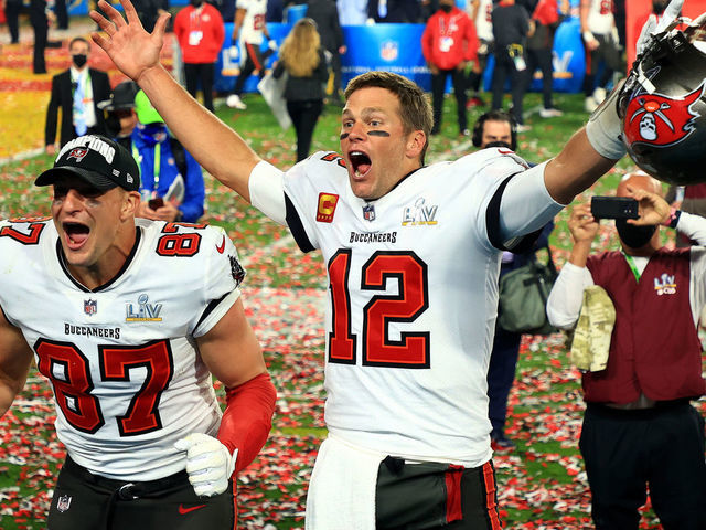TAMPA, FLORIDA - FEBRUARY 07: Rob Gronkowski #87 and Tom Brady #12 of the Tampa Bay Buccaneers celebrate after defeating the Kansas City Chiefs in Super Bowl LV at Raymond James Stadium on February 07, 2021 in Tampa, Florida. The Buccaneers defeated the Chiefs 31-9.