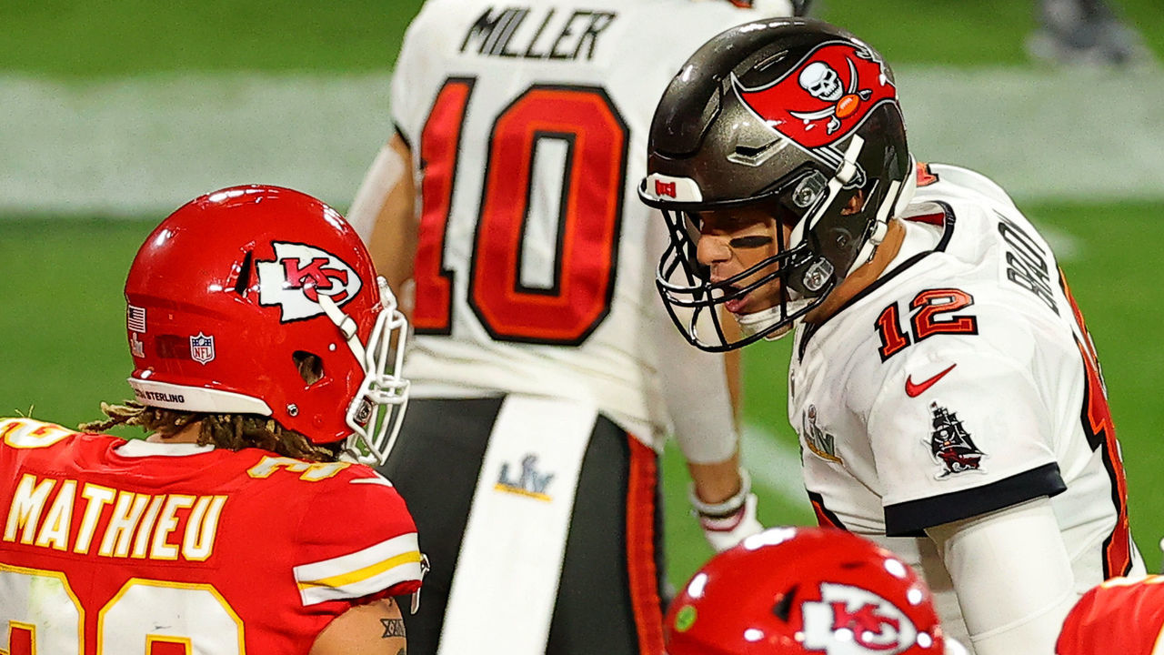 TAMPA, FLORIDA - FEBRUARY 07: Tom Brady #12 of the Tampa Bay Buccaneers speaks to Tyrann Mathieu #32 of the Kansas City Chiefs during the second quarter in Super Bowl LV at Raymond James Stadium on February 07, 2021 in Tampa, Florida.