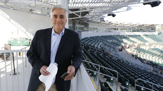 MESA, AZ - MARCH 3: Perdo Gomez of ESPN stands in the stands prior to the game between the Oakland Athletics and the San Francisco Giants at Hohokam Stadium on March 3, 2015 in Mesa, Arizona.