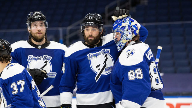 TAMPA, FL - FEBRUARY 5: Goalie Andrei Vasilevskiy #88 of the Tampa Bay Lightning celebrates the win with teammates Victor Hedman #77 and Pat Maroon #14 and against the Detroit Red Wings at Amalie Arena on February 5, 2021 in Tampa, Florida.