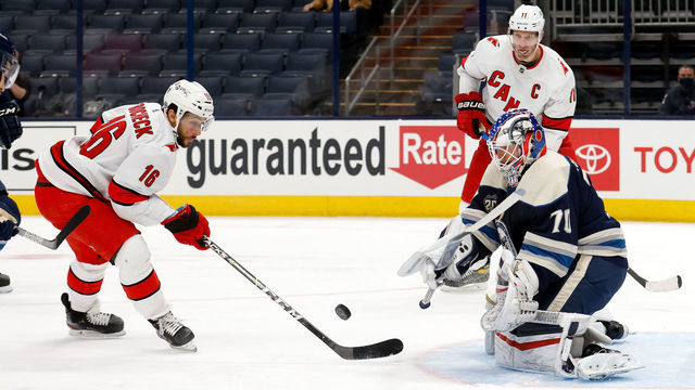 COLUMBUS, OH - FEBRUARY 7: Joonas Korpisalo #70 of the Columbus Blue Jackets stops a shot by Vincent Trocheck #16 of the Carolina Hurricanes during the first period at Nationwide Arena on February 7, 2021 in Columbus, Ohio.