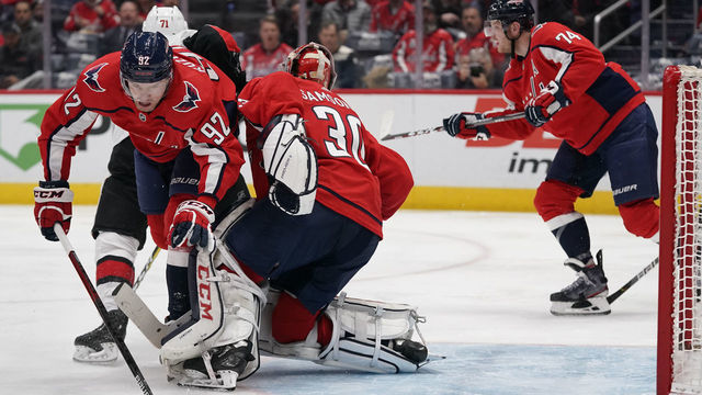 WASHINGTON, DC - JANUARY 07: Evgeny Kuznetsov #92 of the Washington Capitals collides with teammate Ilya Samsonov #30 in the second period against the Ottawa Senators at Capital One Arena on January 7, 2020 in Washington, DC.