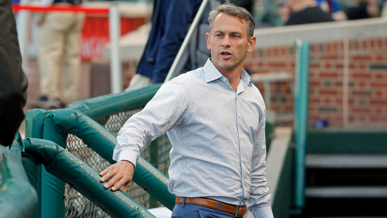 CHICAGO, IL - APRIL 18: Executive Vice President and General Manager Jed Hoyer of the Chicago Cubs talks to media as he walks in to the dugout before the game against the Milwaukee Brewers at Wrigley Field on April 18, 2017 in Chicago, Illinois.
