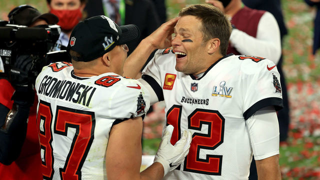 TAMPA, FLORIDA - FEBRUARY 07: Rob Gronkowski #87 and Tom Brady #12 of the Tampa Bay Buccaneers celebrate after defeating the Kansas City Chiefs in Super Bowl LV at Raymond James Stadium on February 07, 2021 in Tampa, Florida. The Buccaneers defeated the Chiefs 31-9.