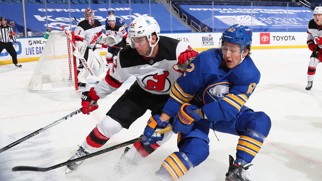 BUFFALO, NY - JANUARY 31: Brandon Montour #62 of the Buffalo Sabres skates during an NHL game against Ryan Murray #22 of the New Jersey Devils the New Jersey Devils on January 31, 2021 at KeyBank Center in Buffalo, New York. New Jersey won, 5-3.