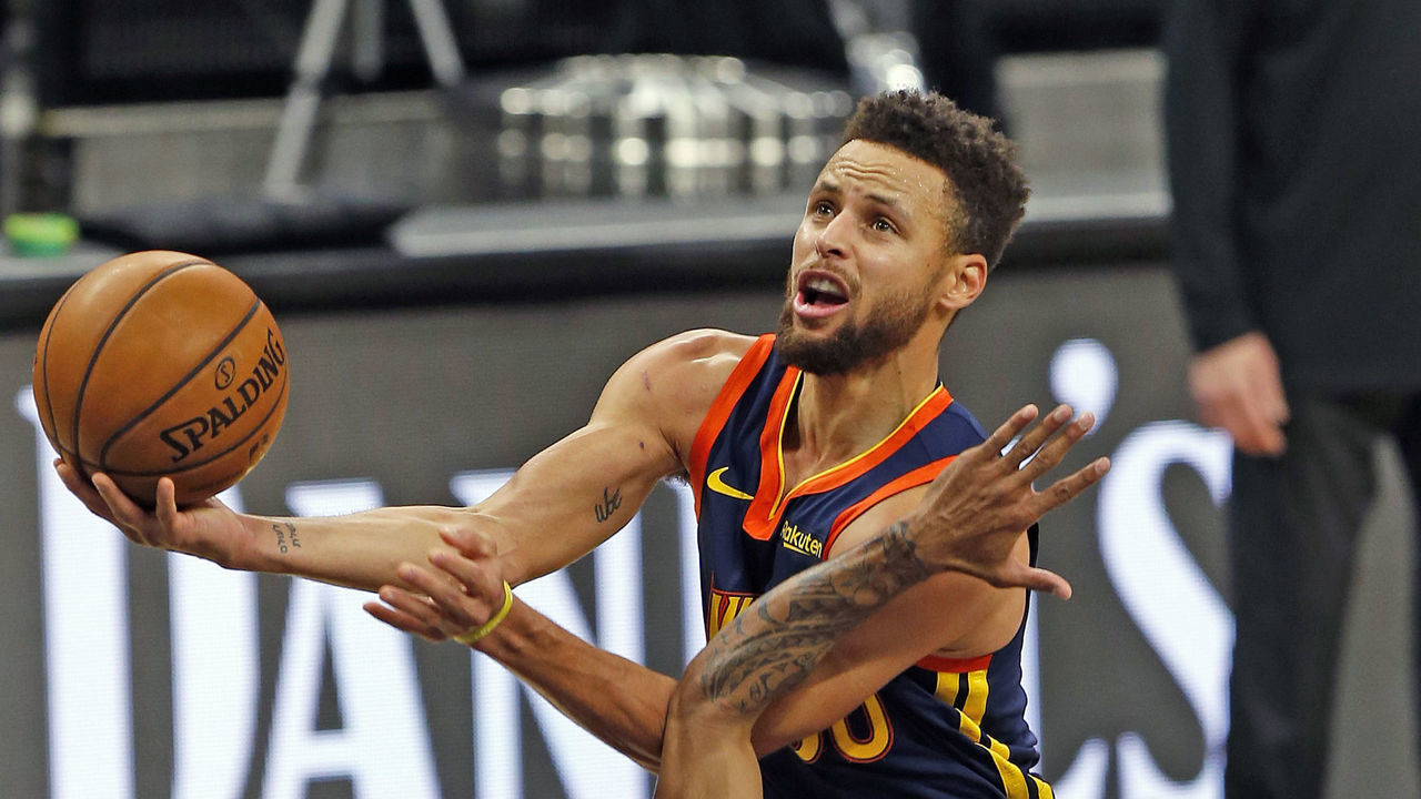 SAN ANTONIO, TX - FEBRUARY 08: Stephen Curry #30 of the Golden State Warriors scores over Patty Mills #8 of the San Antonio Spurs during the second half at AT&T Center on February 8, 2021 in San Antonio, Texas. San Antonio Spurs defeated Golden State Warriors 105-100. NOTE TO USER: User expressly acknowledges and agrees that , by downloading and or using this photograph, User is consenting to the terms and conditions of the Getty Images License Agreement.