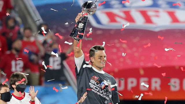 TAMPA, FL - FEBRUARY 07: Super Bowl MVP Tom Brady (12) of the Buccaneers holds the Lombardi Trophy as he is surrounded by his kids Benjamin Brady, John Edward Thomas Moynahan and Vivian Lake Brady after the Super Bowl LV game between the Kansas City Chiefs and the Tampa Bay Buccaneers on February 7, 2021 at Raymond James Stadium, in Tampa, FL.