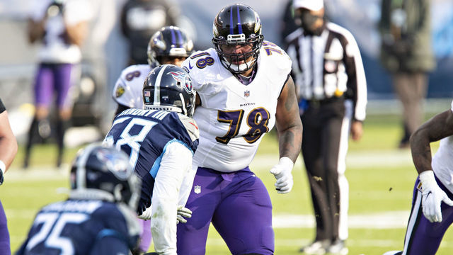 NASHVILLE, TENNESSEE - JANUARY 10: Tackle Orlando Brown Jr. #79 of the Baltimore Ravens blocks at the line of scrimmage during their AFC Wild Card Playoff game against the Tennessee Titans at Nissan Stadium on January 10, 2021 in Nashville, Tennessee. The Ravens defeated the Titans 20-13.