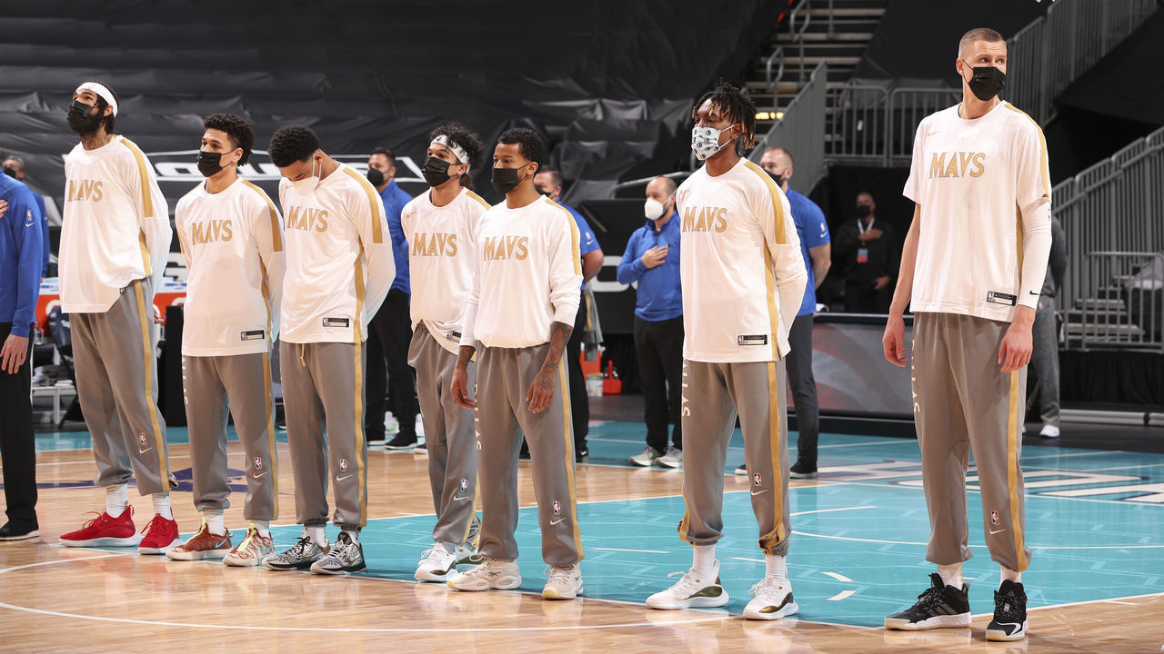 CHARLOTTE, NC - JANUARY 13: The Dallas Mavericks listen to the national anthem before the game against the Charlotte Hornets on January 13, 2021 at Spectrum Center in Charlotte, North Carolina. Mandatory Copyright Notice: Copyright 2021 NBAE