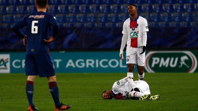 Paris Saint-Germain's French defender Abdou Diallo complains as Paris Saint-Germain's Brazilian forward Neymar lies on the pitch during the French Cup round-of-64 football match between Stade Malherbe Caen and Paris Saint-Germain at the Michel-d'Ornano Stadium in Caen, northwestern France on February 10, 2021.