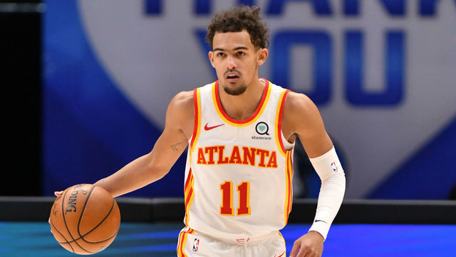 DALLAS, TX - FEBRUARY 10: Trae Young #11 of the Atlanta Hawks handles the ball against the Dallas Mavericks on February 10, 2021 at the American Airlines Center in Dallas, Texas. Mandatory Copyright Notice: Copyright 2021 NBAE