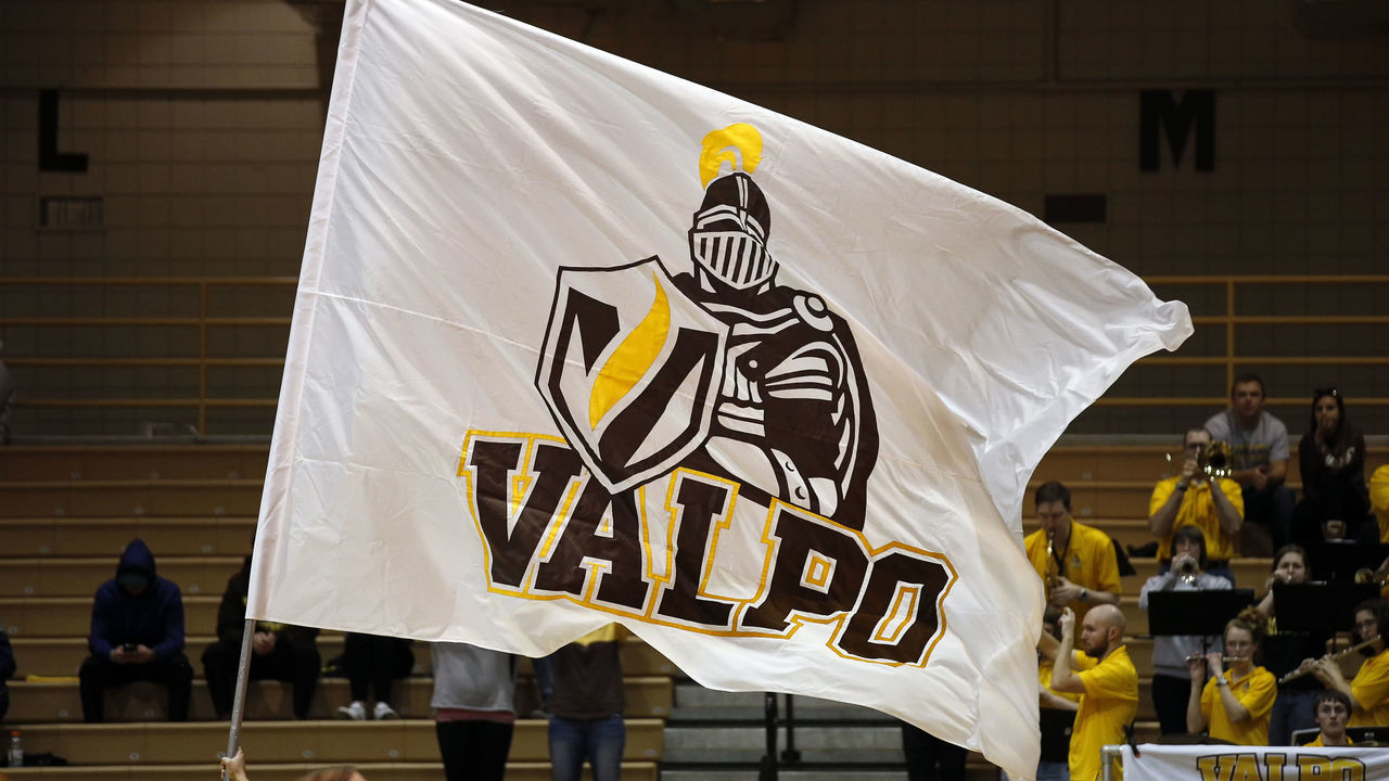 VALPARAISO, IN - FEBRUARY 09: A Valparaiso Crusaders cheerleader waves a Valparaiso Crusaders flag in action during the first half of a game between the Cleveland State Vikings and the Valparaiso Crusaders on February 09, 2017 at the Athletics-Recreation Center in Valparaiso, IN.