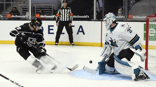 LOS ANGELES, CA - FEBRUARY 09: Adrian Kempe #9 of the Los Angeles Kings shoots the puck against goaltender Martin Jones #31 of the San Jose Sharks during the second period at Staples Center on February 9, 2021 in Los Angeles, California.
