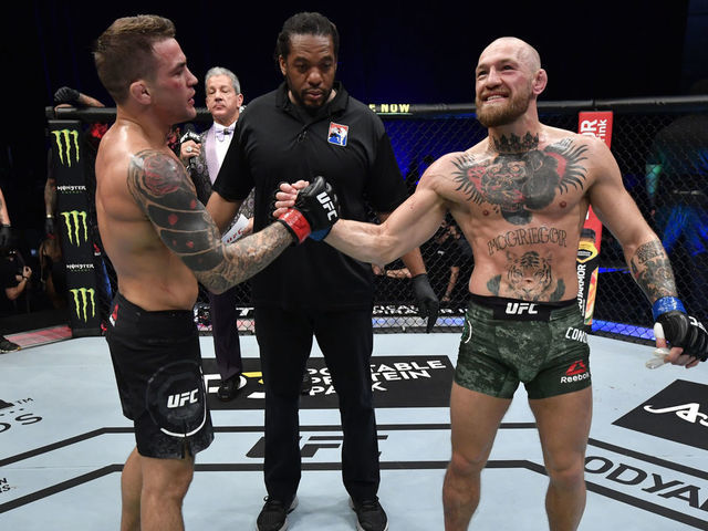 ABU DHABI, UNITED ARAB EMIRATES - JANUARY 23: (L-R) Dustin Poirier greets Conor McGregor of Ireland after his victory in their lightweight fight during the UFC 257 event inside Etihad Arena on UFC Fight Island on January 23, 2021 in Abu Dhabi, United Arab Emirates.