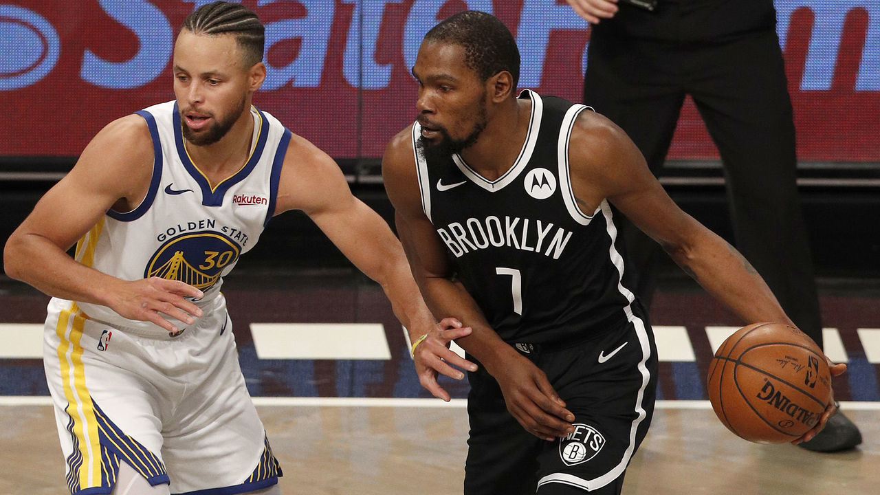 NEW YORK, NEW YORK - DECEMBER 22: (NEW YORK DAILIES OUT) Kevin Durant #7 of the Brooklyn Nets in action against Stephen Curry #30 of the Golden State Warriors at Barclays Center on December 22, 2020 in New York City. The Nets defeated the Warriors 125-99. NOTE TO USER: User expressly acknowledges and agrees that, by downloading and/or using this photograph, user is consenting to the terms and conditions of the Getty Images License Agreement.