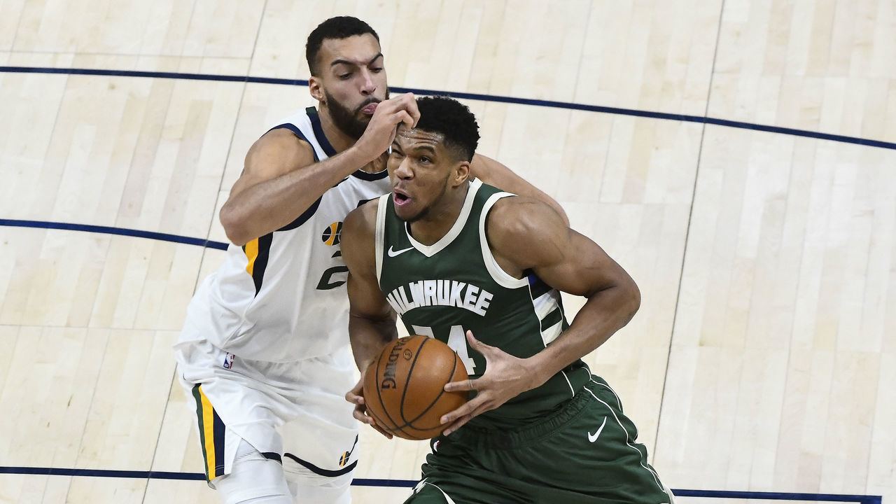 SALT LAKE CITY, UTAH - FEBRUARY 12: Giannis Antetokounmpo #34 of the Milwaukee Bucks drives into Rudy Gobert #27 of the Utah Jazz during a game at Vivint Smart Home Arena on February 12, 2021 in Salt Lake City, Utah. NOTE TO USER: User expressly acknowledges and agrees that, by downloading and/or using this photograph, user is consenting to the terms and conditions of the Getty Images License Agreement.