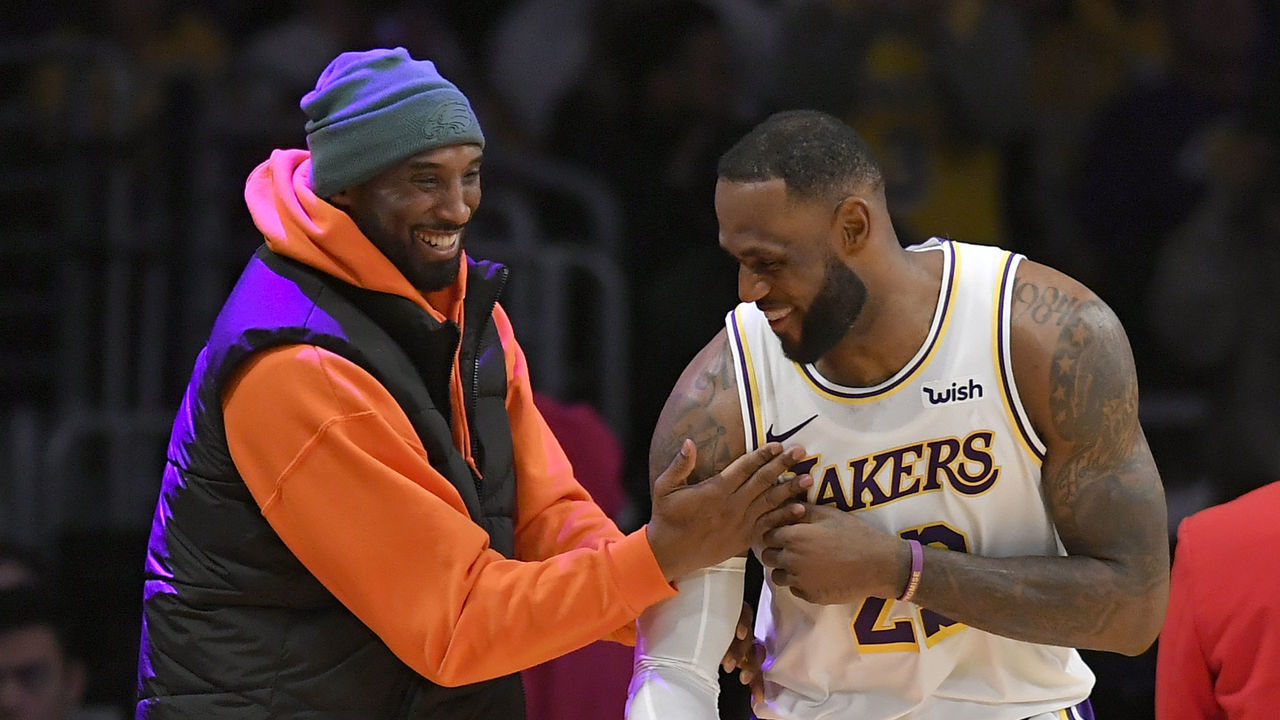 LOS ANGELES, CA - DECEMBER 29: LeBron James #23 of the Los Angeles Lakers has a moment on the sideline with former Laker Kobe Bryant in the second half during a game against the Dallas Mavericks at Staples Center on December 29, 2019 in Los Angeles, California. NOTE TO USER: User expressly acknowledges and agrees that, by downloading and/or using this photograph, user is consenting to the terms and conditions of the Getty Images License Agreement.