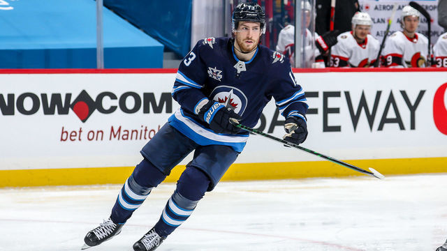 WINNIPEG, MB - FEBRUARY 11: Pierre-Luc Dubois #13 of the Winnipeg Jets follows the play down the ice during second period action against the Ottawa Senators at the Bell MTS Place on February 11, 2021 in Winnipeg, Manitoba, Canada.
