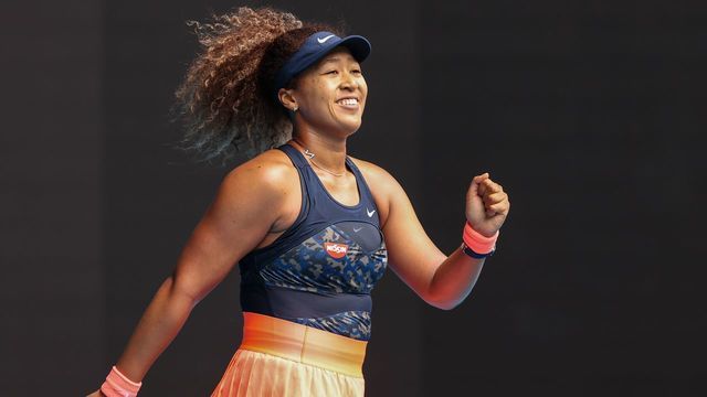 Japan's Naomi Osaka celebrates her victory against Spain's Garbine Muguruza during their women's singles match on day seven of the Australian Open tennis tournament in Melbourne on February 14, 2021.