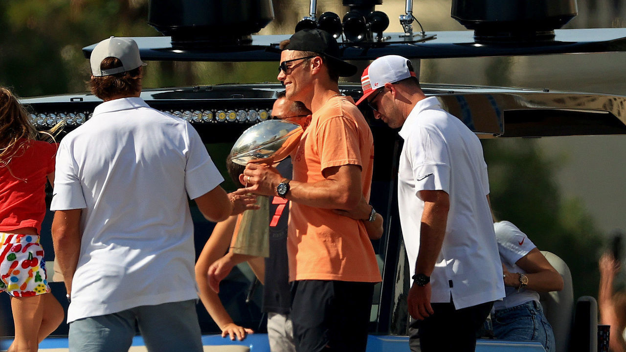 TAMPA, FLORIDA - FEBRUARY 10: Tom Brady #12 of the Tampa Bay Buccaneers celebrates their Super Bowl LV victory with the Vince Lombardi trophy during a boat parade through the city on February 10, 2021 in Tampa, Florida.