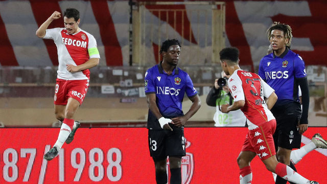 Monaco's French forward Wissam Ben Yedder (R) celebrates after scoring during the French L1 football match between AS Monaco and OGC Nice at the "Louis II Stadium" in Monaco on February 3, 2020.