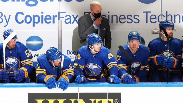 BUFFALO, NY - JANUARY 31: Head coach Ralph Krueger and Buffalo Sabres players follow the action during an NHL game against the New Jersey Devils on January 31, 2021 at KeyBank Center in Buffalo, New York.