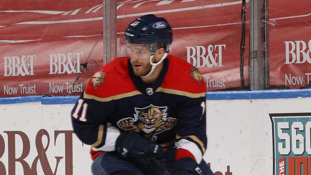 SUNRISE, FL - FEBRUARY 13: Jonathan Huberdeau #11 of the Florida Panthers circles behind the Tampa Bay Lightning net with the puck during third period action at the BB&T Center on February 13, 2021 in Sunrise, Florida.