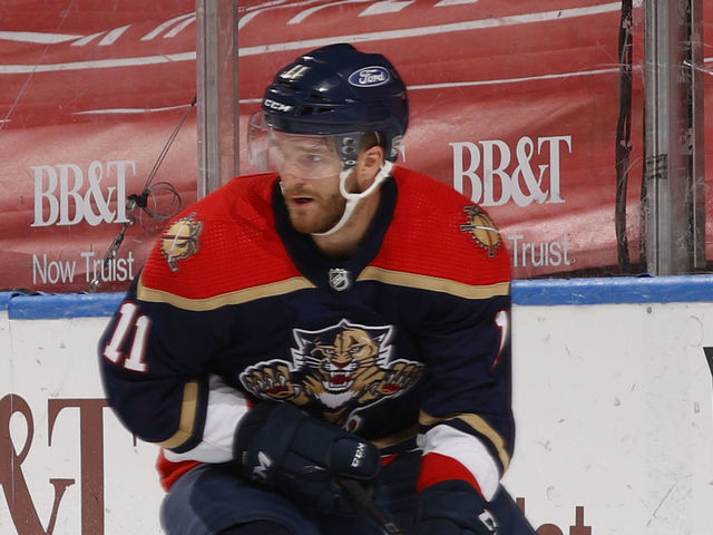SUNRISE, FL - FEBRUARY 13: Jonathan Huberdeau #11 of the Florida Panthers circles behind the Tampa Bay Lightning net with the puck during third period action at the BB&T Center on February 13, 2021 in Sunrise, Florida.