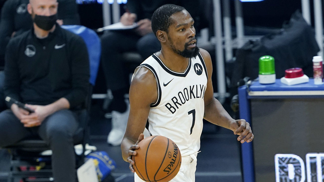 SAN FRANCISCO, CALIFORNIA - FEBRUARY 13: Kevin Durant #7 of the Brooklyn Nets dribbles the ball up court against the Golden State Warriors during the first half of an NBA basketball game at Chase Center on February 13, 2021 in San Francisco, California.