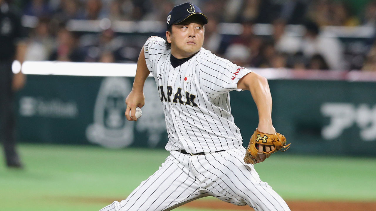 FUKUOKA, JAPAN - NOVEMBER 06: Hirokazu Sawamura #15 of Japan in action during the send-off friendly match for WBSC Premier 12 between Japan and Puerto Rico at the Fukuoka Dome on November 6, 2015 in Fukuoka, Japan.