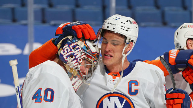 BUFFALO, NY - FEBRUARY 15: Semyon Varlamov #40 and Anders Lee #27 of the New York Islanders celebrate their 3-1 victory against the Buffalo Sabres following an NHL game on February 15, 2021 at KeyBank Center in Buffalo, New York.