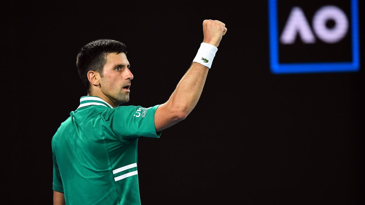 Serbia's Novak Djokovic celebrates a point against Germany's Alexander Zverev during their men's singles quarter-final match on day nine of the Australian Open tennis tournament in Melbourne on February 16, 2021.