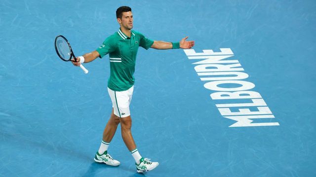 Serbia's Novak Djokovic reacts as he plays against Germany's Alexander Zverev during their men's singles quarter-final match on day nine of the Australian Open tennis tournament in Melbourne on February 16, 2021.