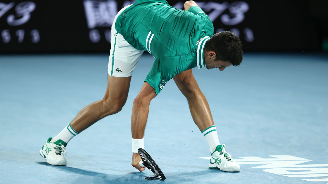 MELBOURNE, AUSTRALIA - FEBRUARY 16: Novak Djokovic of Serbia smashes his racquet in his Men's Singles Quarterfinals match against Alexander Zverev of Germany during day nine of the 2021 Australian Open at Melbourne Park on February 16, 2021 in Melbourne, Australia.