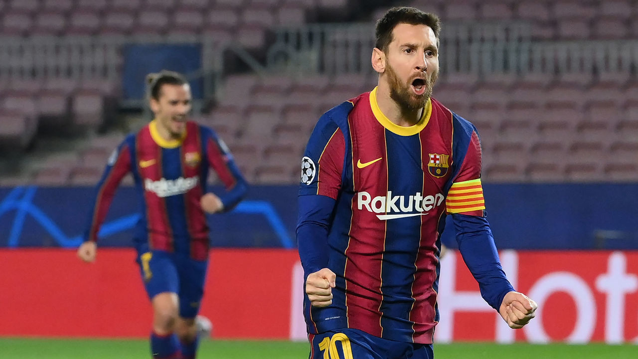 Barcelona's Argentinian forward Lionel Messi celebrates after scoring a goal during the UEFA Champions League round of 16 first leg football match between FC Barcelona and Paris Saint-Germain FC at the Camp Nou stadium in Barcelona on February 16, 2021.