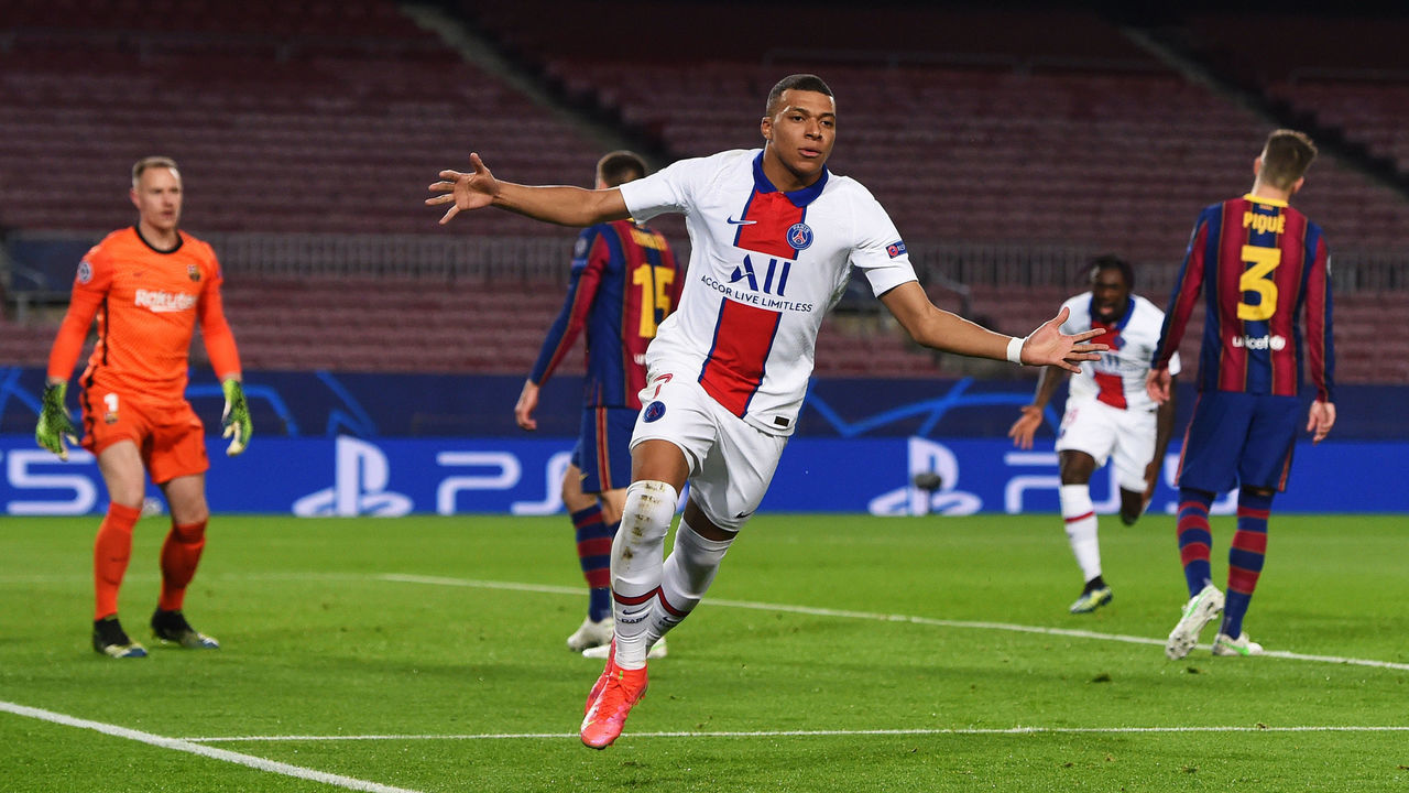 BARCELONA, SPAIN - FEBRUARY 16: Kylian Mbappe of Paris Saint-Germain celebrates after scoring their side's first goal during the UEFA Champions League Round of 16 match between FC Barcelona and Paris Saint-Germain at Camp Nou on February 16, 2021 in Barcelona, Spain. Sporting stadiums around Spain remain under strict restrictions due to the Coronavirus Pandemic as Government social distancing laws prohibit fans inside venues resulting in games being played behind closed doors.