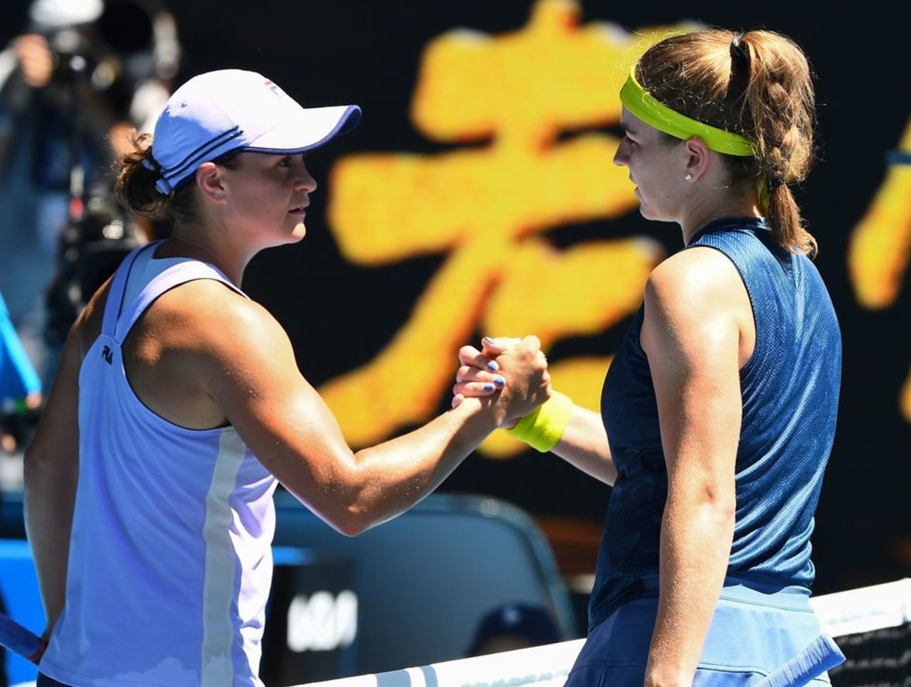 Czech Republic's Karolina Muchova (R) shakes hands with Australia&apos...