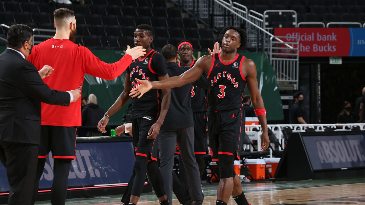 MILWAUKEE, WI - FEBRUARY 16: OG Anunoby #3 of the Toronto Raptors high-fives teammates after the game against the Milwaukee Bucks on February 16, 2021 at the Fiserv Forum Center in Milwaukee, Wisconsin. Mandatory Copyright Notice: Copyright 2021 NBAE .