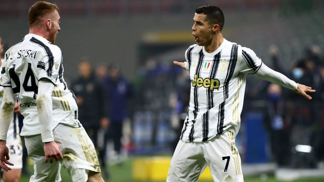 MILAN, ITALY - FEBRUARY 02: Cristiano Ronaldo of Juventus celebrates with team mate Dejan Kulusevski after scoring their side's second goal during the Coppa Italia semi-final match between FC Internazionale and Juventus at Stadio Giuseppe Meazza on February 02, 2021 in Milan, Italy. Sporting stadiums around Italy remain under strict restrictions due to the Coronavirus Pandemic as Government social distancing laws prohibit fans inside venues resulting in games being played behind closed doors.