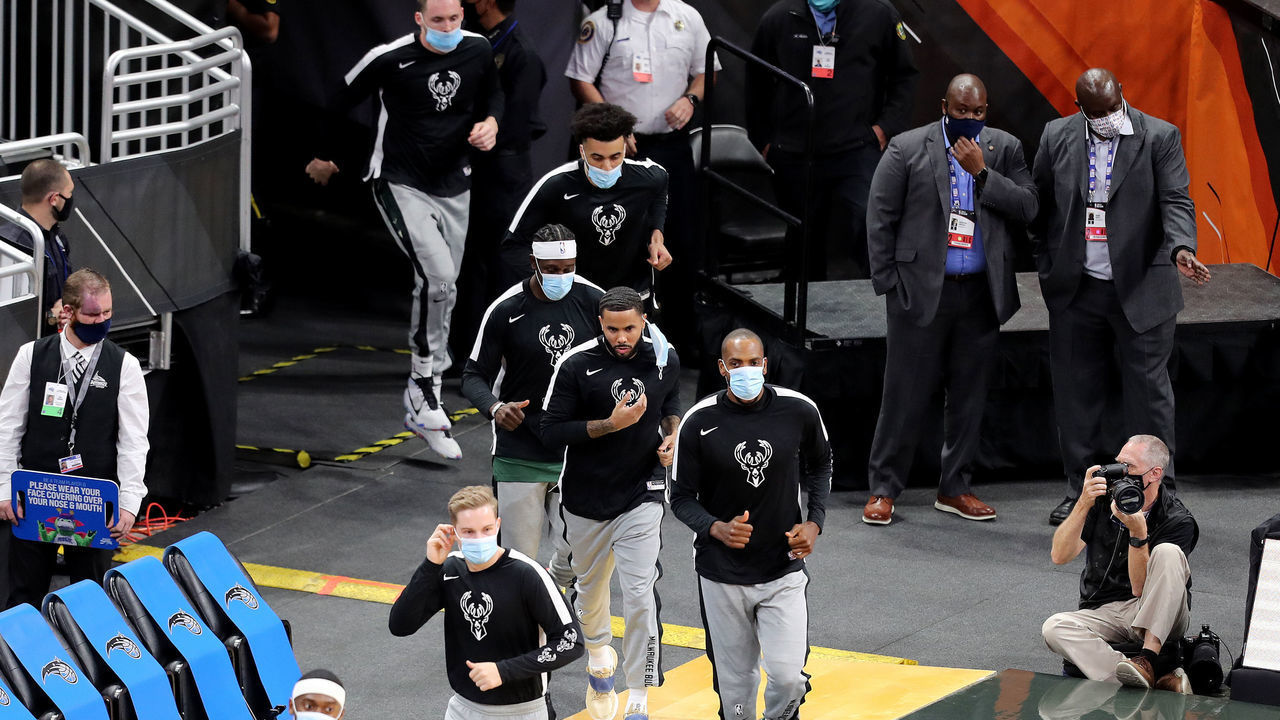 ORLANDO, FL - JANUARY 11: Masked Milwaukee Bucks players enter the court against the Orlando Magic at Amway Center on January 11, 2021 in Orlando, Florida.