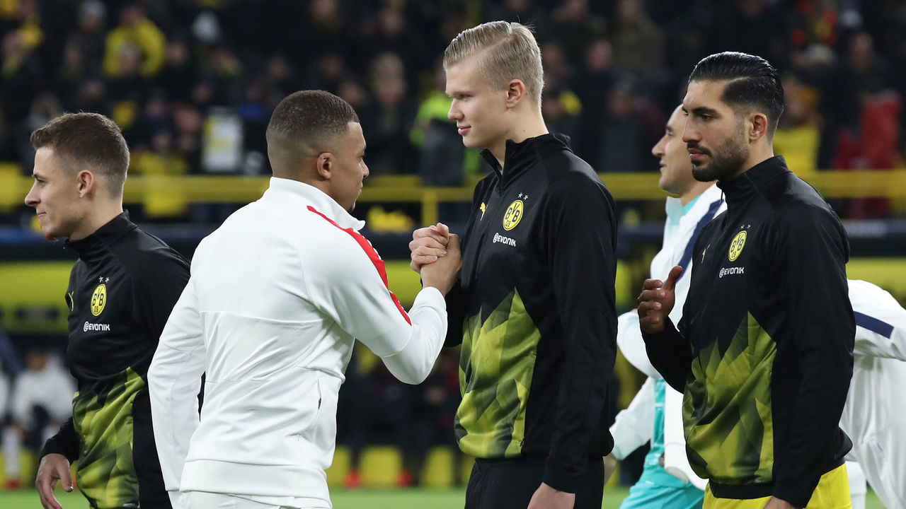 DORTMUND, GERMANY - FEBRUARY 18: Kilian Mbappe of Paris Saint-Germain shakes hands with Erling Haaland of Dortmund prior to the UEFA Champions League round of 16 first leg match between Borussia Dortmund and Paris Saint-Germain at Signal Iduna Park on February 18, 2020 in Dortmund, Germany.