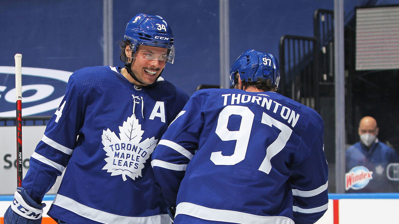 TORONTO, ON - FEBRUARY 15: Auston Matthews #34 of the Toronto Maple Leafs congratulates teammate Joe Thornton #97 on his goal against the Ottawa Senators during an NHL game at Scotiabank Arena on February 15, 2021 in Toronto, Ontario, Canada.
