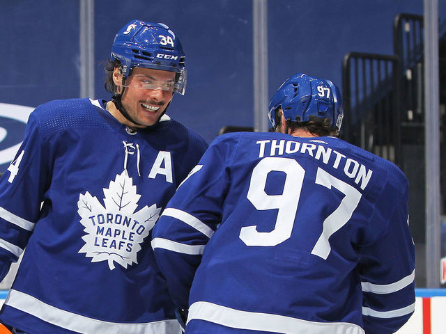 TORONTO, ON - FEBRUARY 15: Auston Matthews #34 of the Toronto Maple Leafs congratulates teammate Joe Thornton #97 on his goal against the Ottawa Senators during an NHL game at Scotiabank Arena on February 15, 2021 in Toronto, Ontario, Canada.