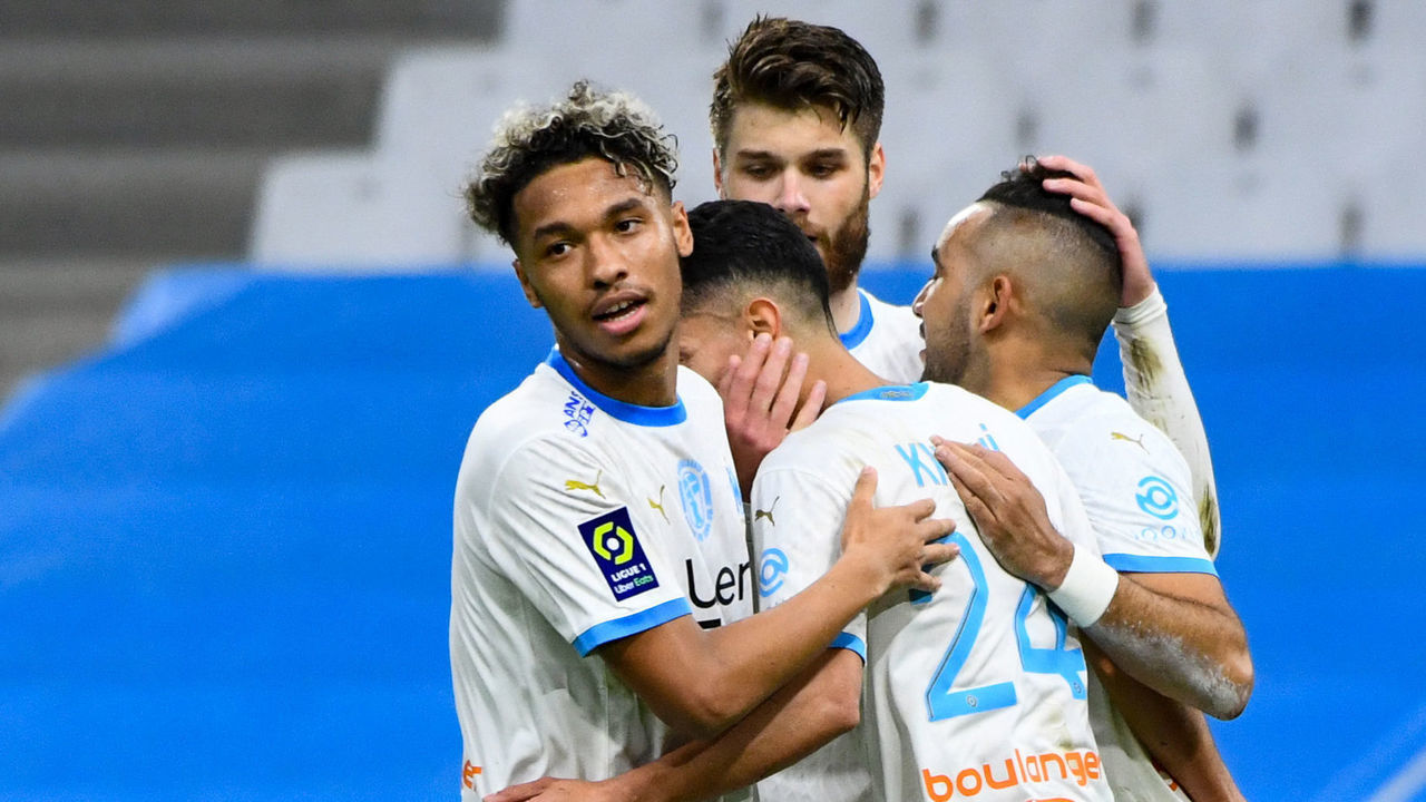 Marseille's players celebrate after scoring a goal during the French L1 football match between Olympique de Marseille (OM) and OGC Nice at the Velodrome Stadium in Marseille, southern France on February 17, 2021.