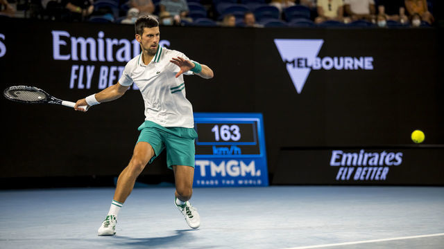 MELBOURNE, VIC - FEBRUARY 18: Novak Djokovic of Serbia returns the ball during the semifinals of the 2021 Australian Open on February 18 2021, at Melbourne Park in Melbourne, Australia.